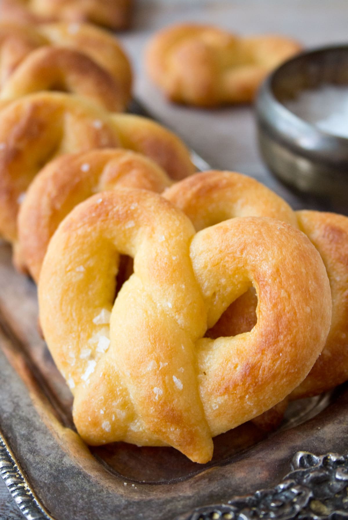 Pretzels lined up on a tray.