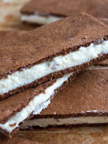 Homemade kinder milk slices stacked on top of each other.