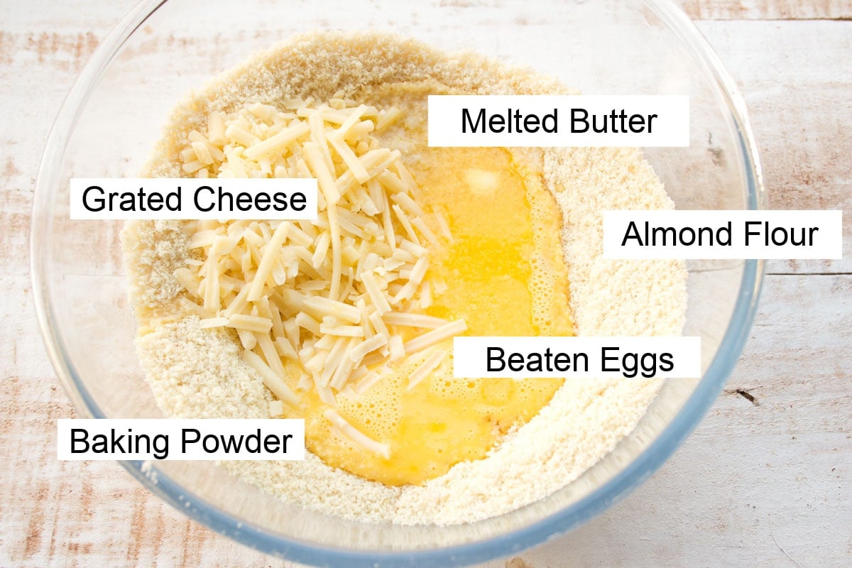 Ingredients to make keto biscuits measured into a large mixing bowl and labelled.