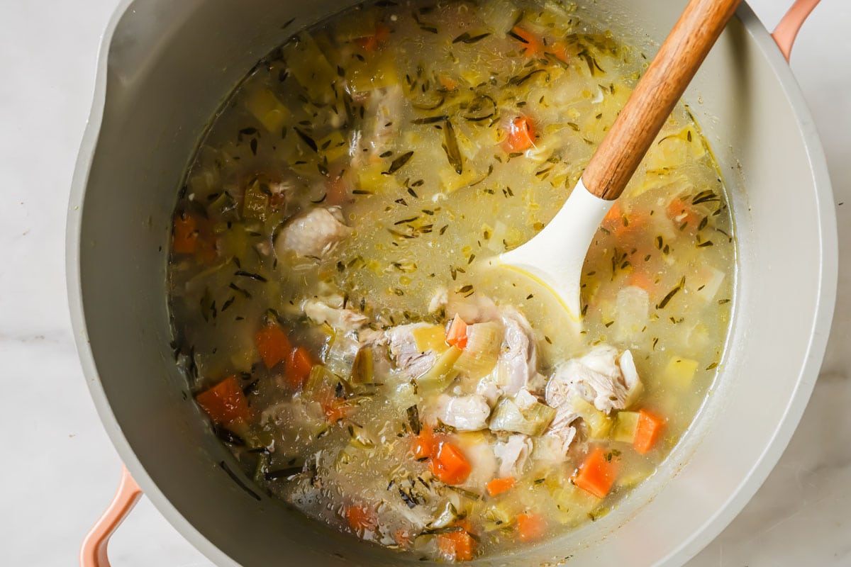 Chicken soup in a pot.