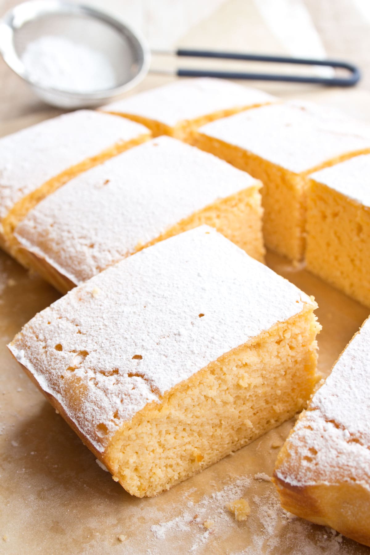 Lemon bars topped with powdered sweetener.