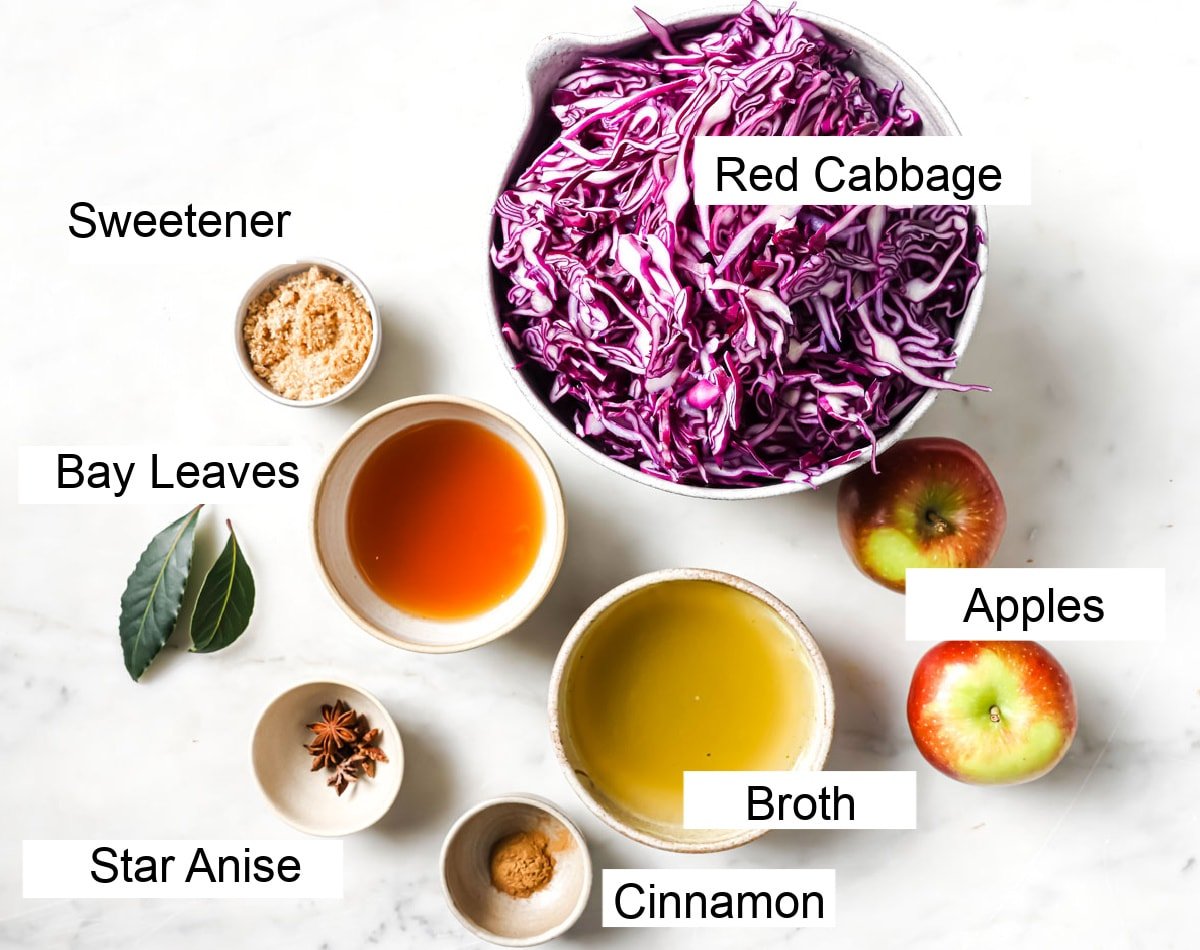 Shredded red cabbage in a bowl and all other ingredients to make this recipe, measured and labelled.
