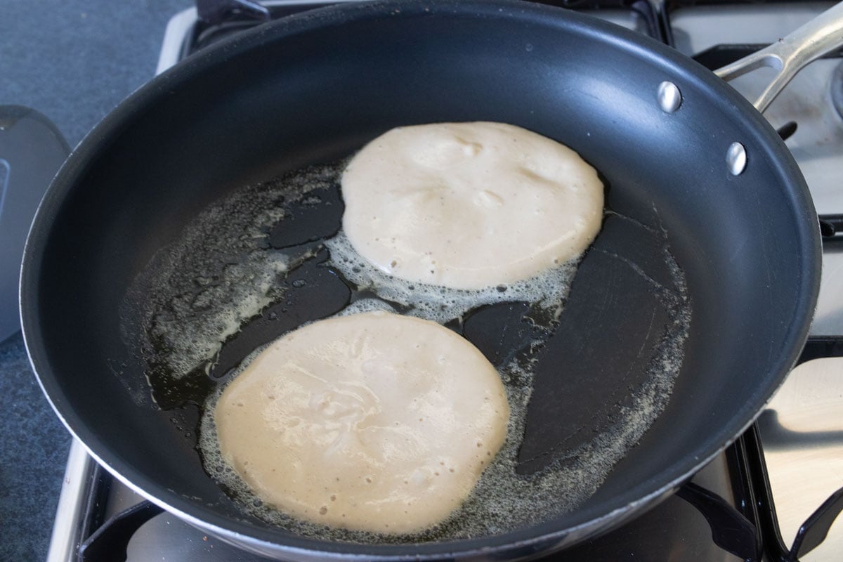 Pancake batter in a frying pan.