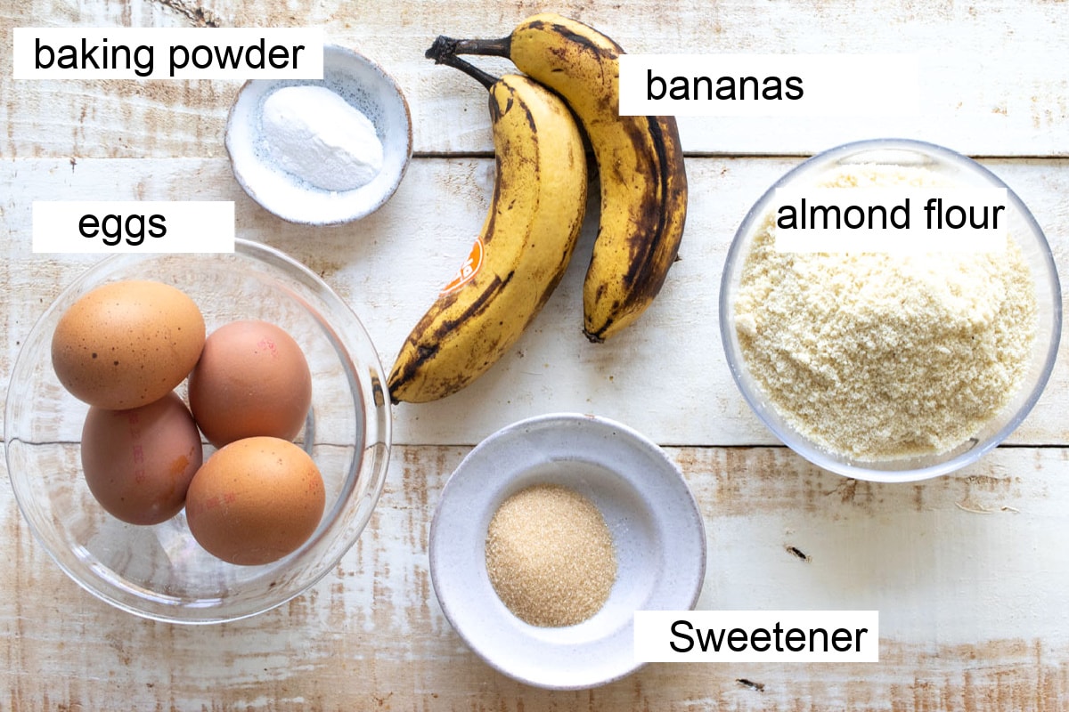 Bananas, eggs, almond flour and other ingredients for this recipe measured into bowls.