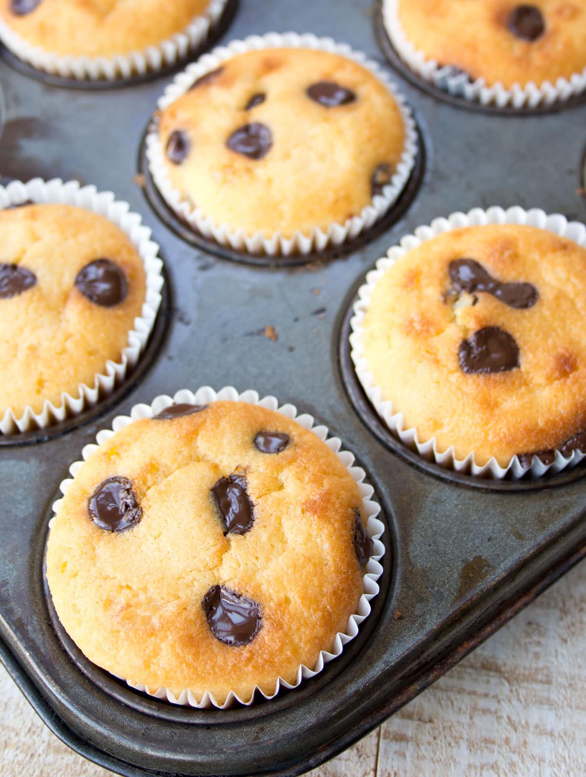 Baked almond flour muffins in a muffin pan.