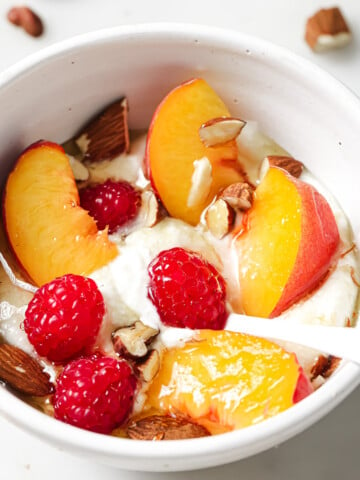 Blended cottage cheese in a bowl topped with fruit.