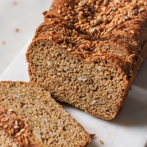 A sliced loaf of flaxseed bread.