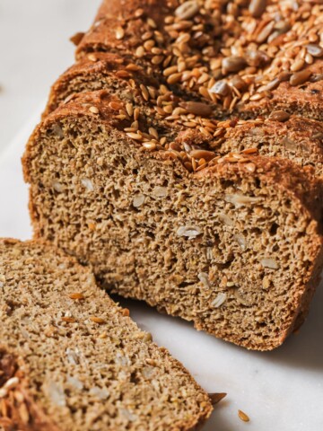 A sliced loaf of flaxseed bread.