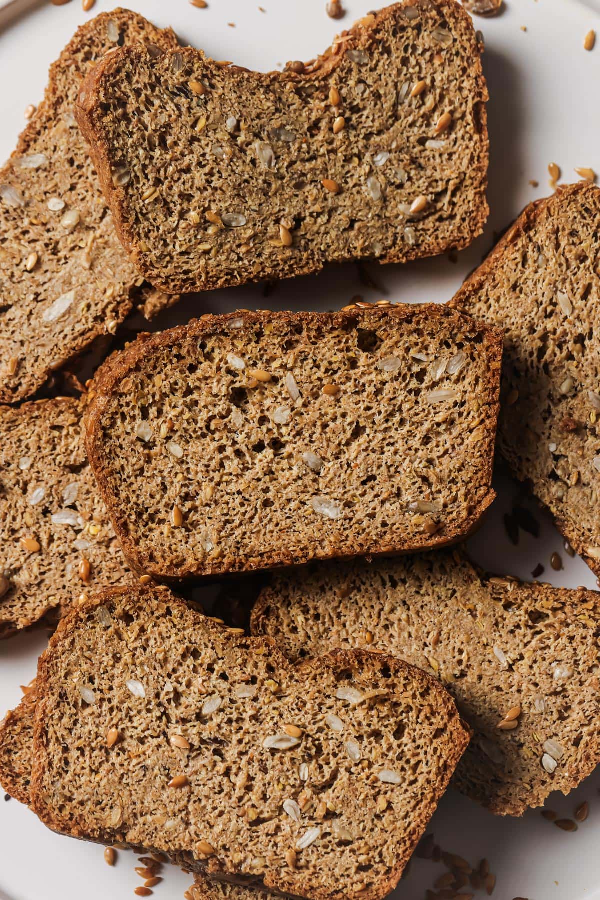 Slices of flaxseed bread on a plate.