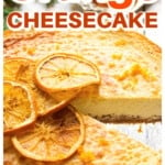 An orange cheesecake topped with dehydrated orange slices.
