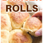 A tray with pull-apart keto bread rolls and a hand taking a roll.