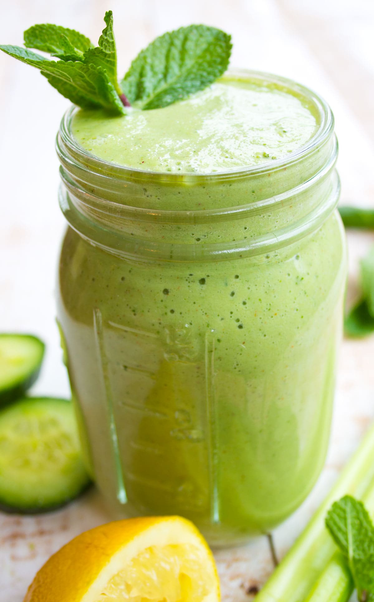 A green smoothie in a mason jar.