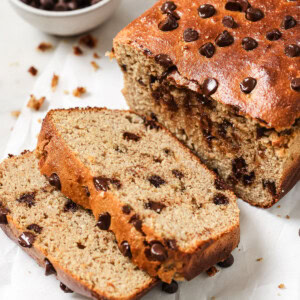 A high protein banana bread with chocolate chips, two slices cut off.