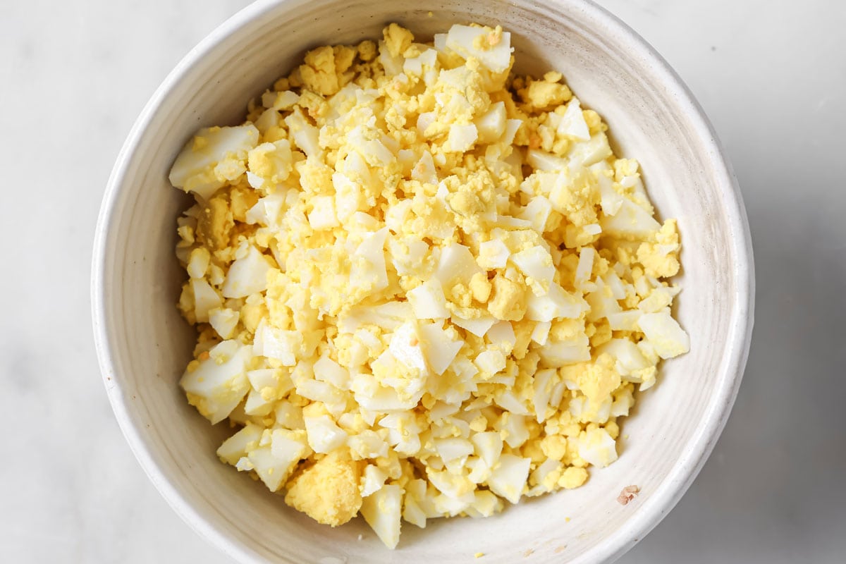 Mashed hard-boiled egg in a bowl.