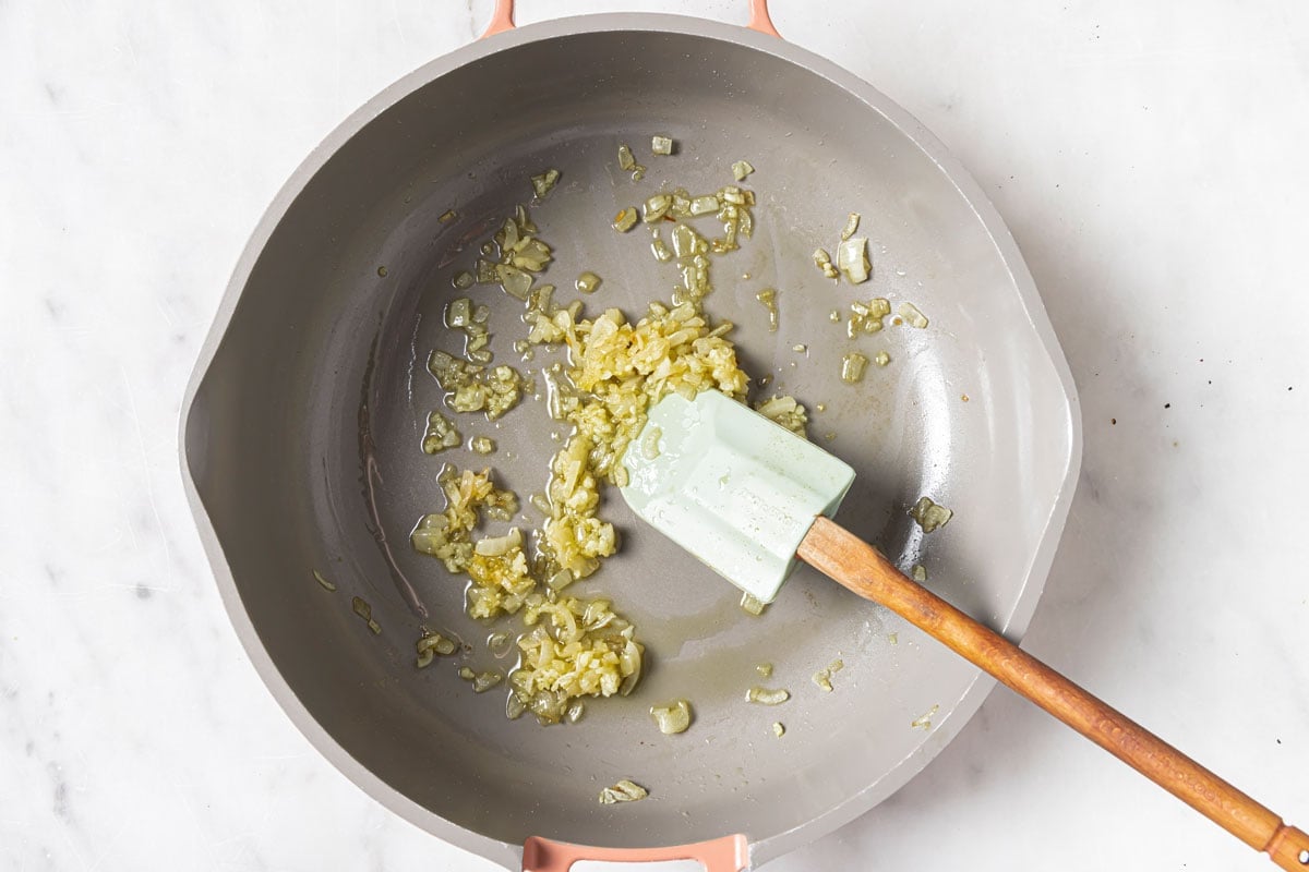 Frying onions in a pan.