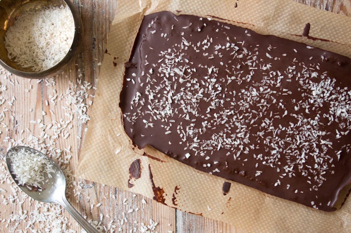 Chocolate topping decorated with desiccated coconut.