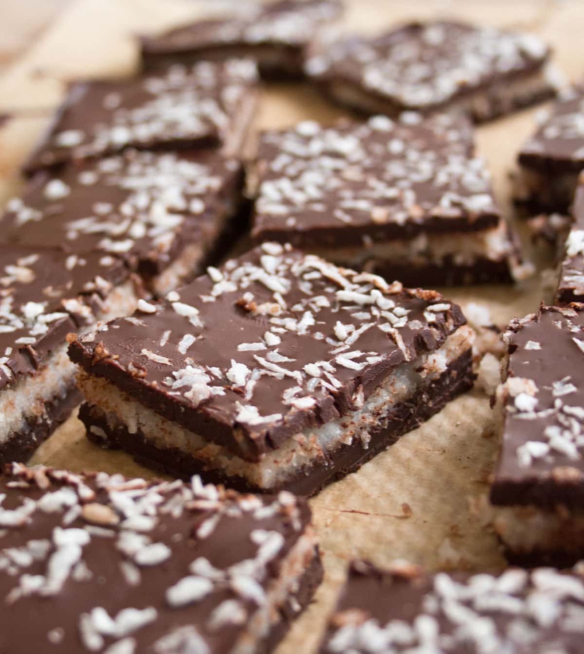 Bounty bar squares on parchment paper.