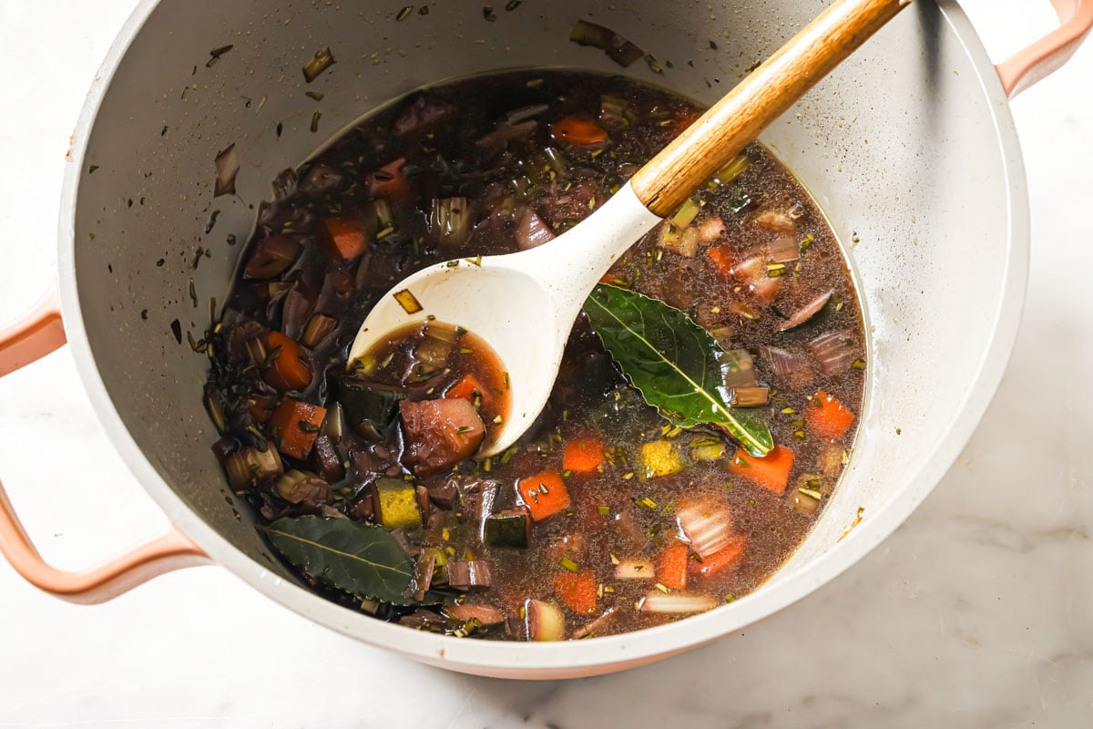 Chopped vegetables in a red wine sauce.