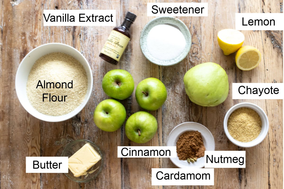 Ingredients to make a sugar free apple crumble, measured into bowls and labelled.