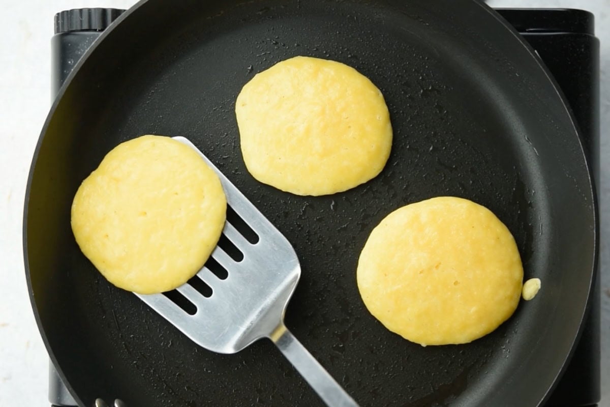 Flipping a pancakes with a spatula.