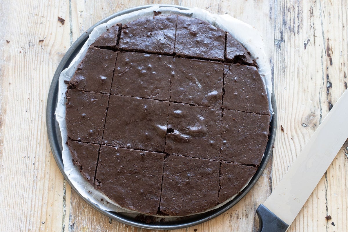 Sliced brownies made in a 6x6 inch springform pan.