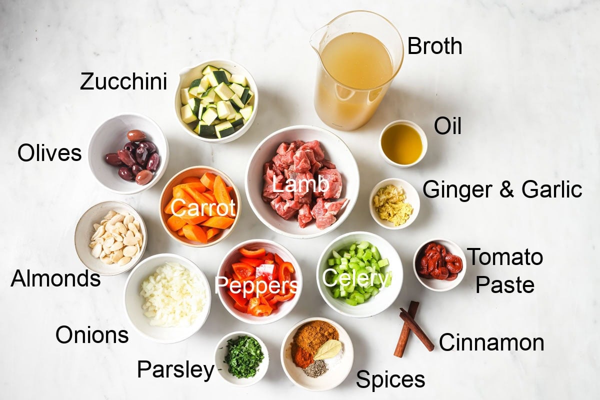 Ingredients to make moroccan lamb stew, measured into bowls and labelled.