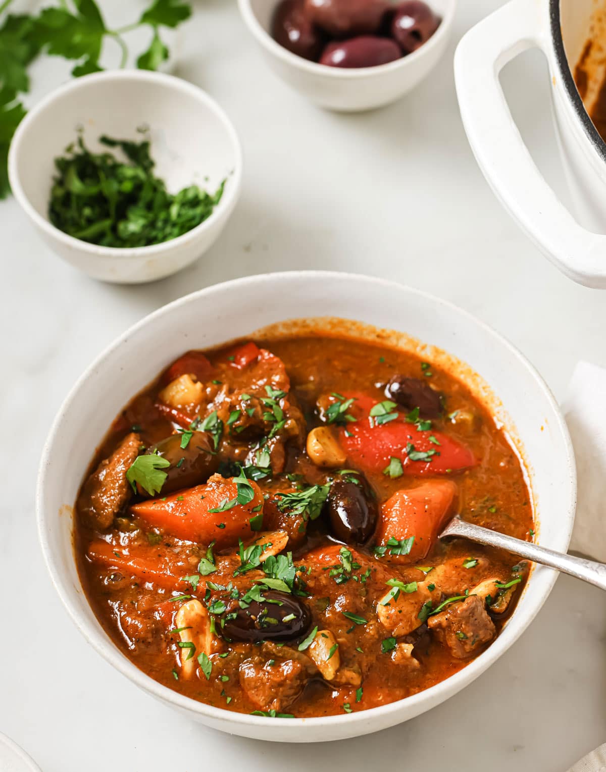 Moroccanl amb stew served in a bowl and a spoon.