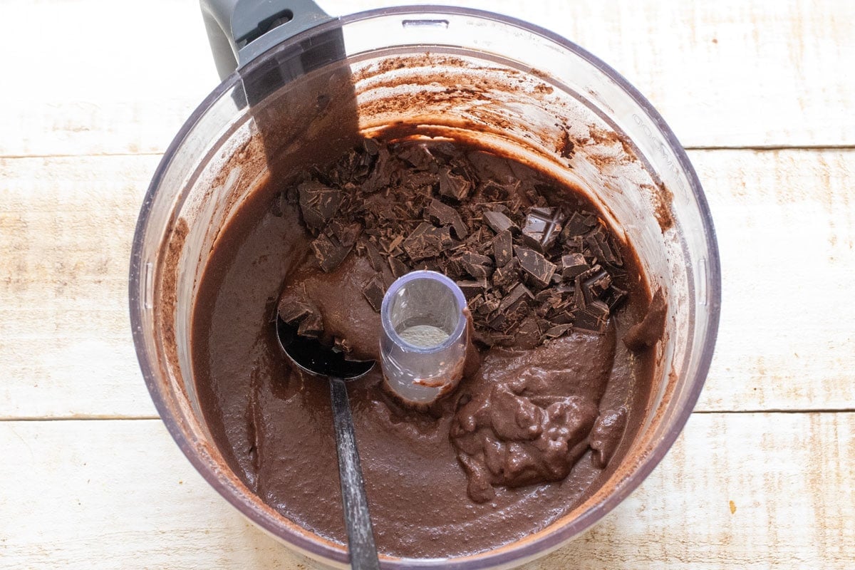 Sturring chocolate chips into the batter.