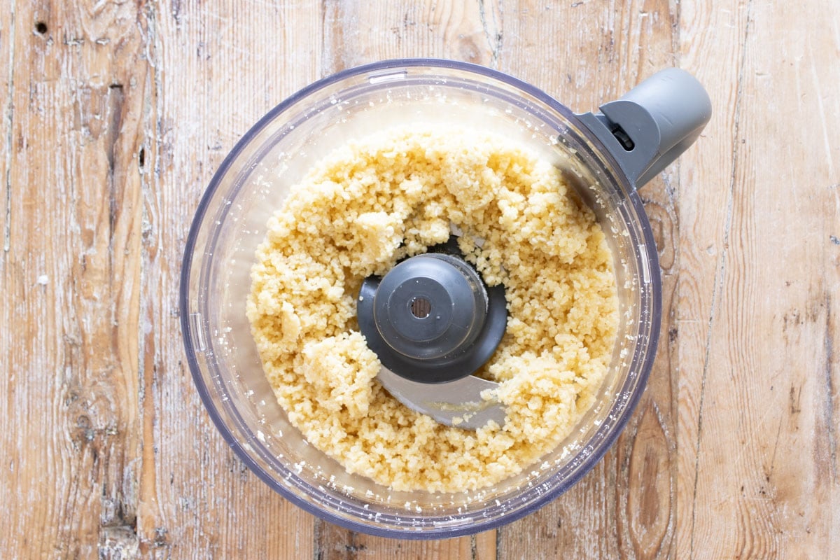 Crumbly dough for the tart base in a bowl.