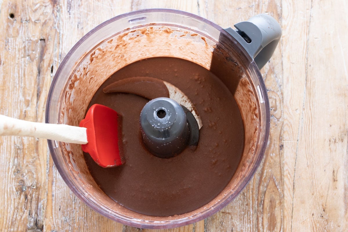 Chocolate fililng in a food processor bowl.