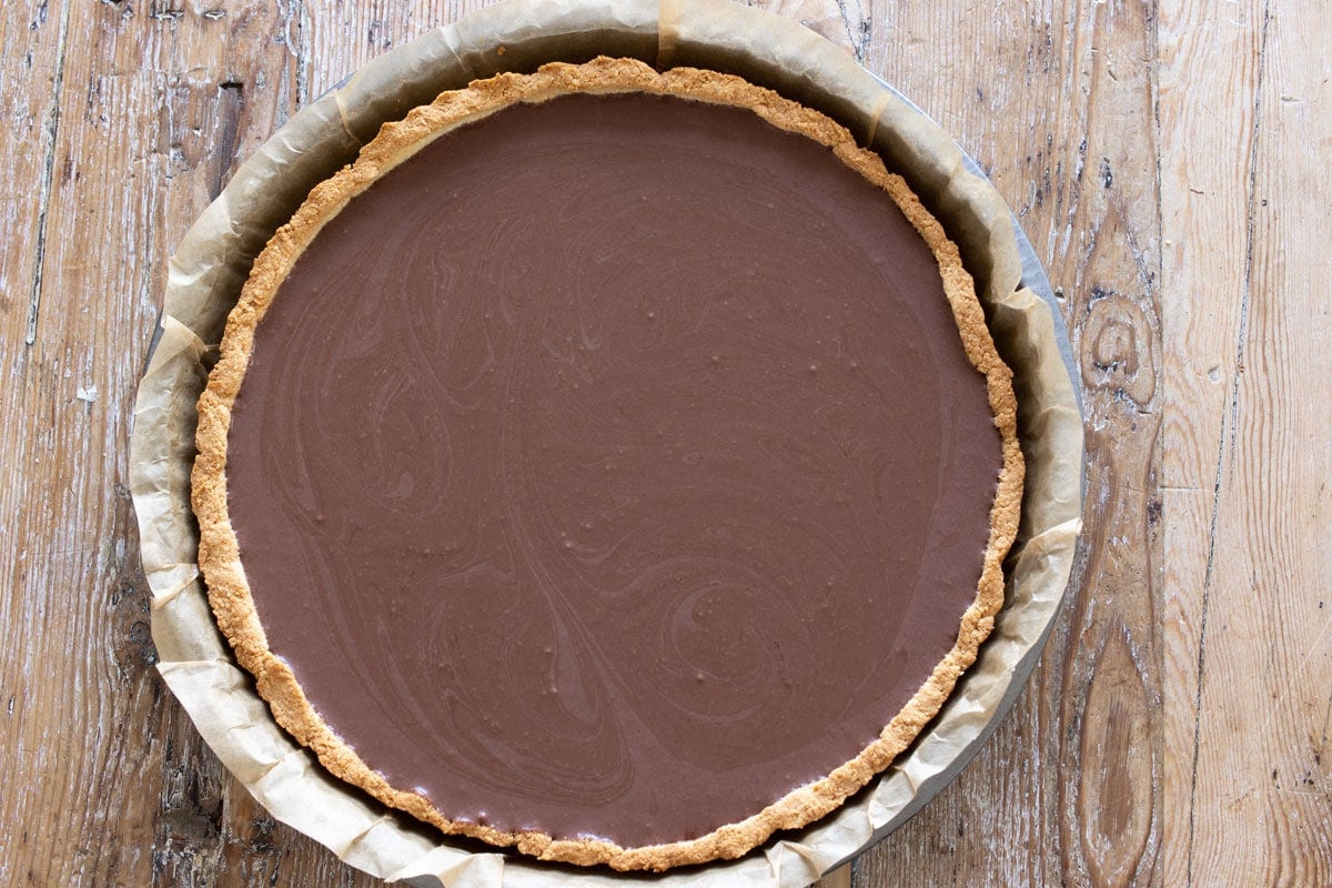 The filling inside the cooled tart crust.