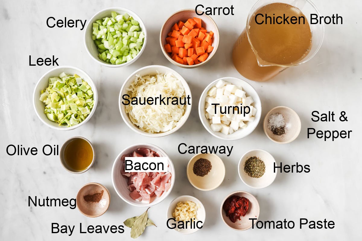 Ingredients to make sauerkraut soup, measured into bowls and labelled.