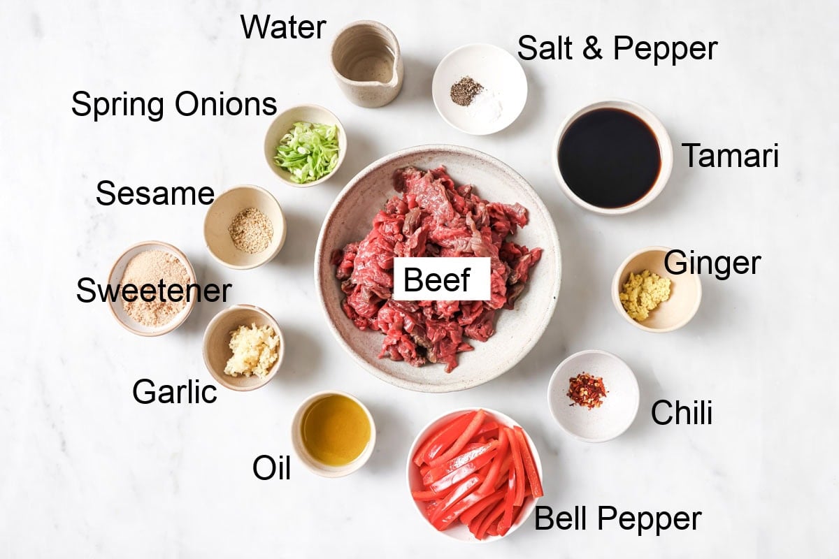 Ingredients to make keto mongolian beef, measured into bowls.