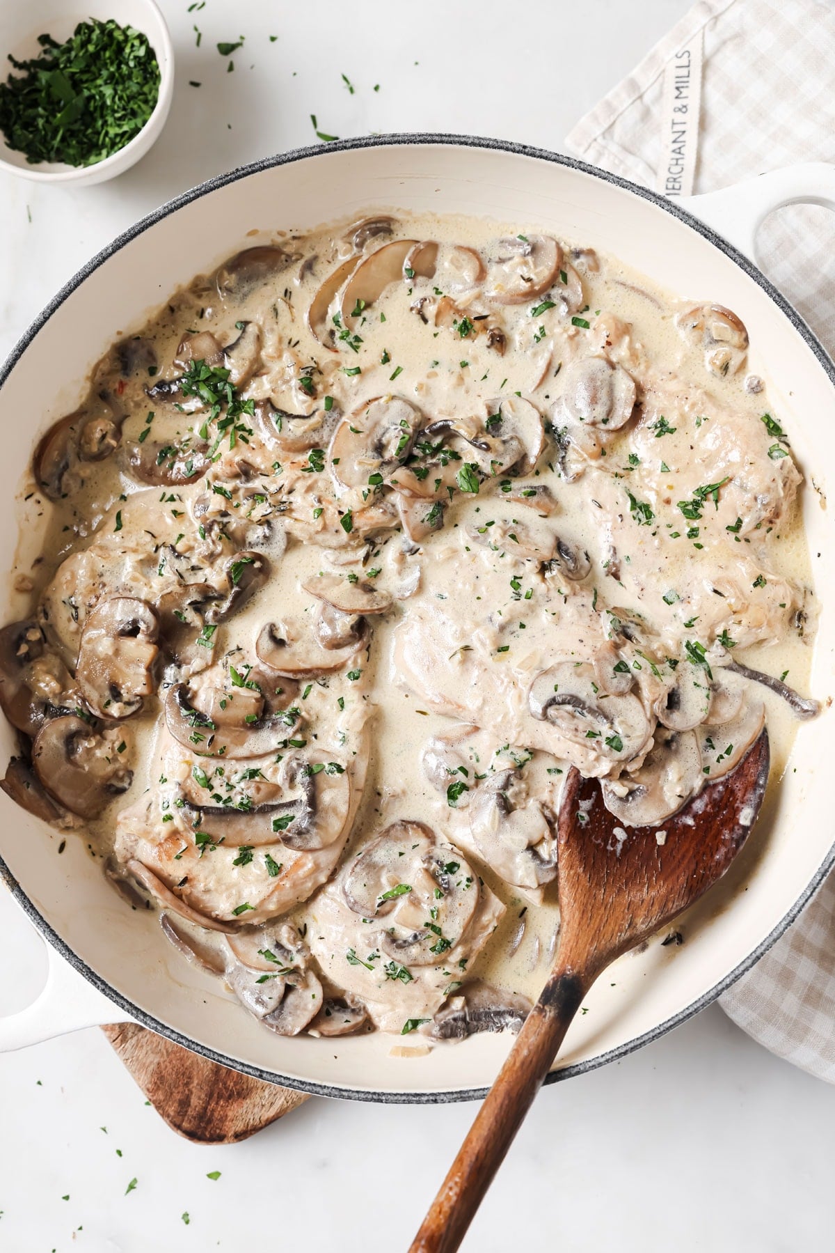 Keto mushroom chicken with a creamy sauce in a pan.