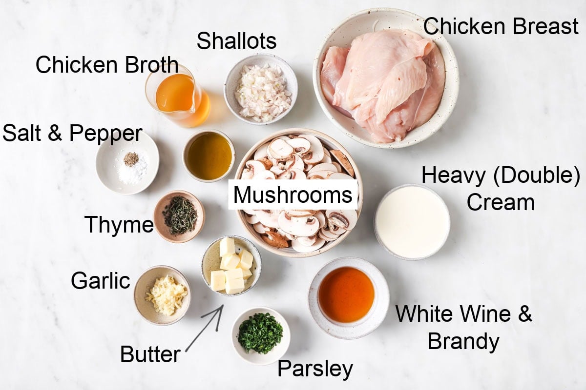Ingredients to make a keto friendly mushroom chicken, all measured into bowls and labelled.