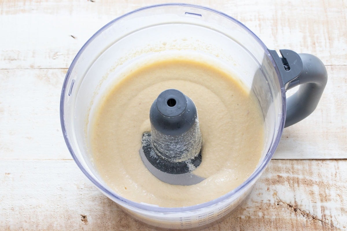 Dough mixture with nut flours in the blender bowl.