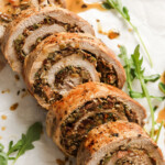 Stuffed pork tenderloin sliced and filled a stuffing of artichoke, sun-dried tomatoes and more.