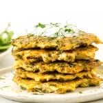 A stack of tuna patties on a plate.