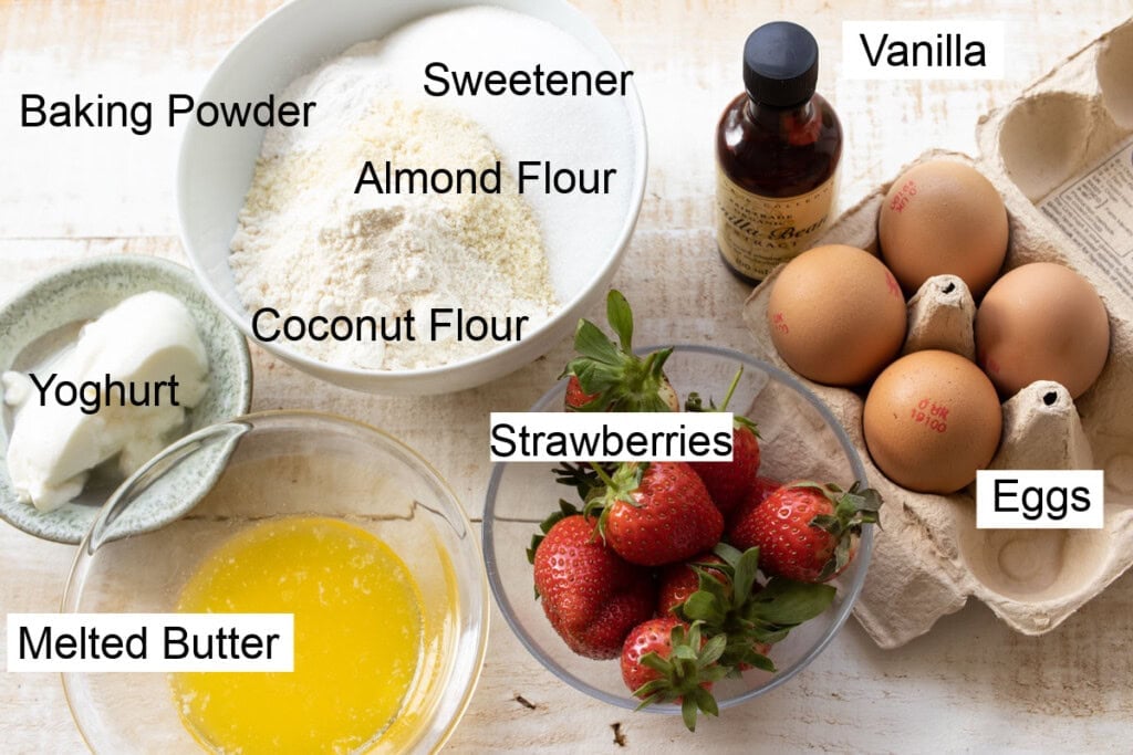 Ingredients to make keto strawberry muffins, measured into bowls and labelled.