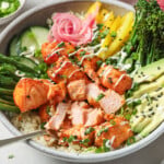 Salmon bowl with cubed and flaked salmon, assorted veggies and cauliflower rice.