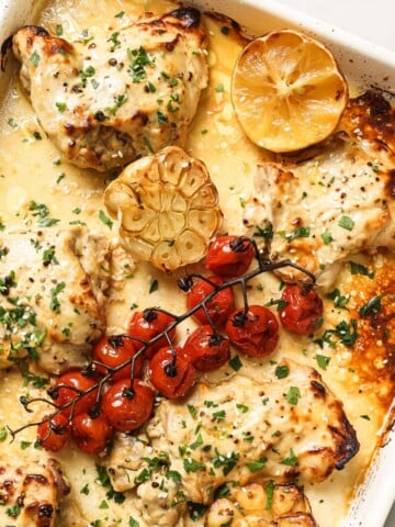 Tahini chicken in a baking dish after roasting in the oven.