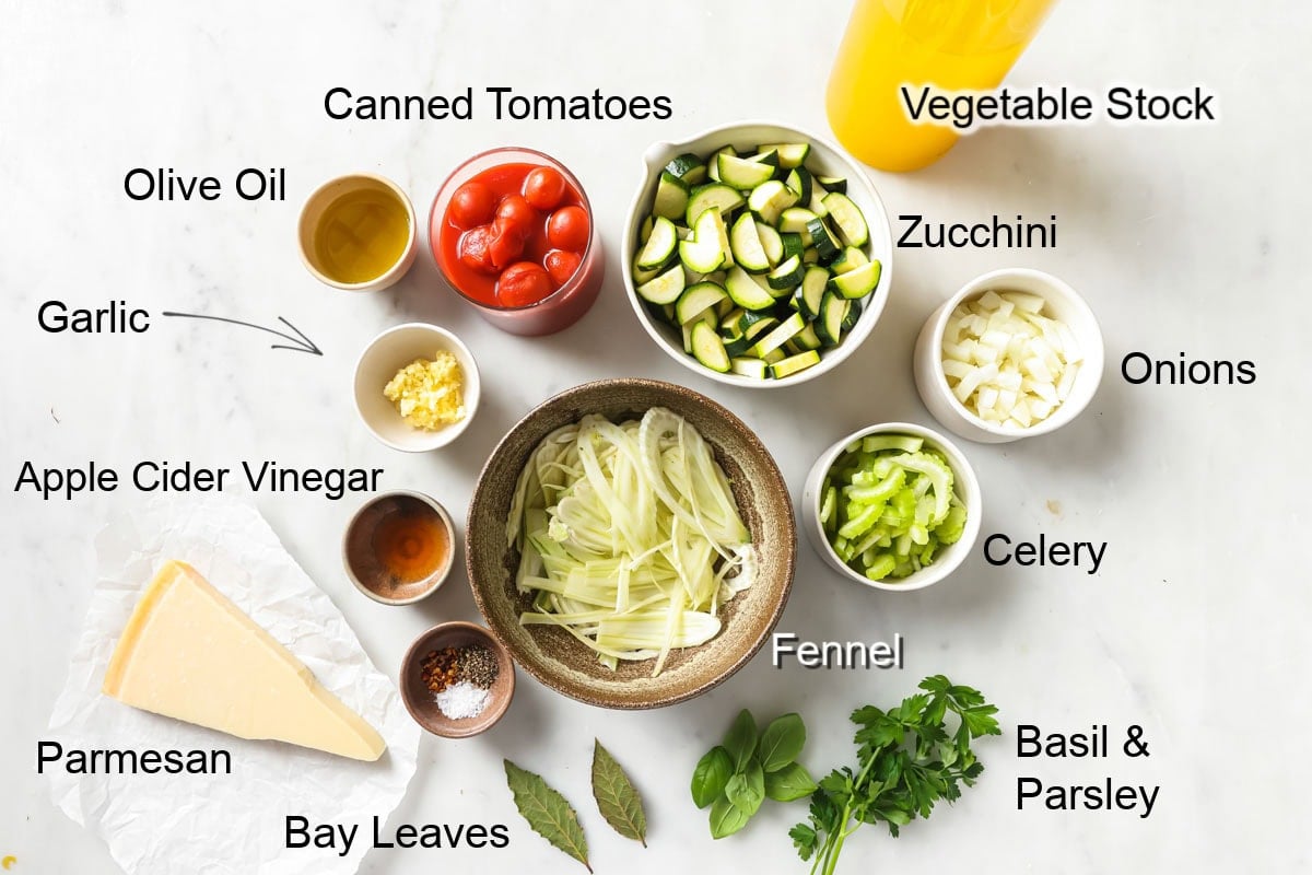 Ingedients to make zucchini soup, measured into bowls and labelled.