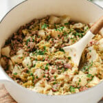 A ground beef and cabbage stew with turnips in a pot.