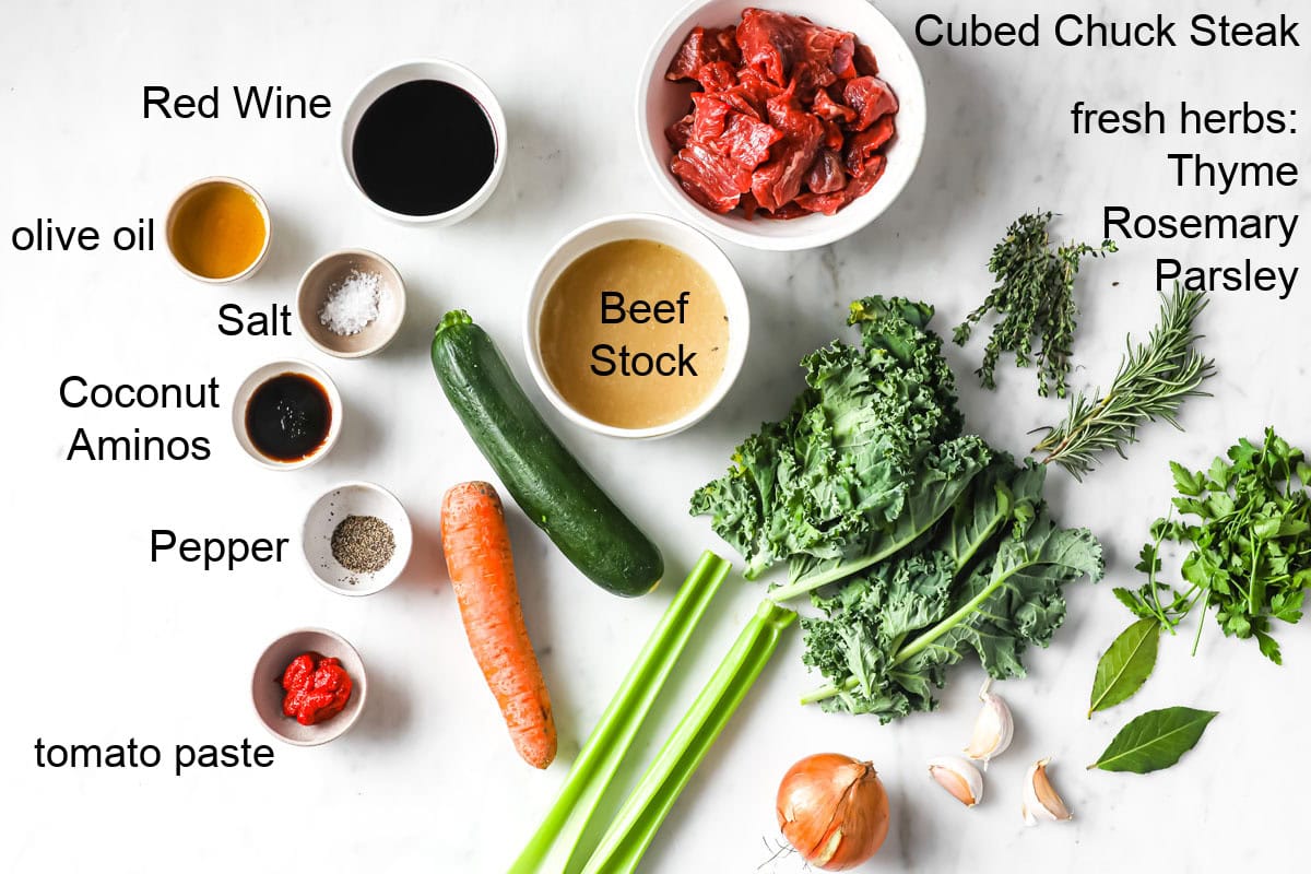 Ingredients to make keto beef stew, measured into bowls and labelled.