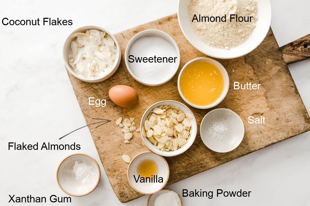 Ingredients to make keto oatmeal cookies, measured into bowls and labelled.