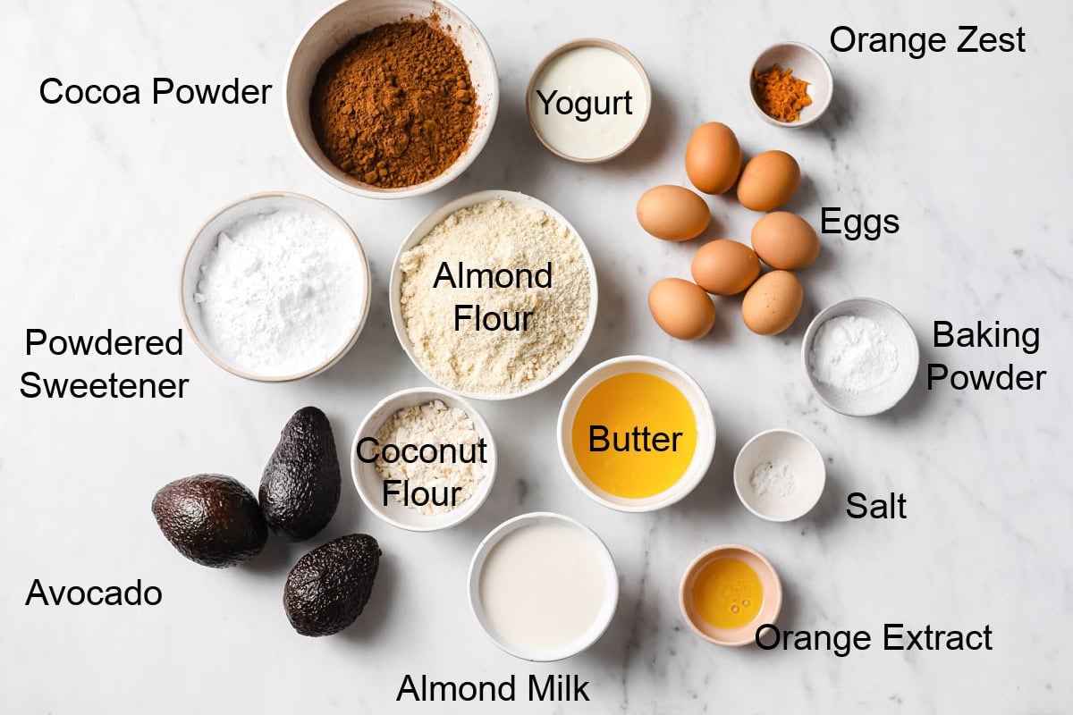 Ingredients to make a chocolate orange cake, measured into bowls and labelled.