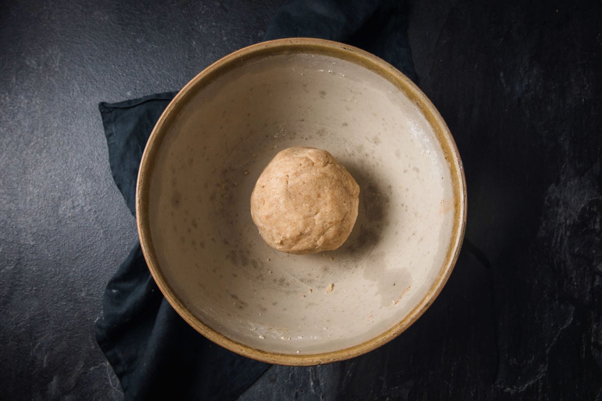 Cookie dough ball in a mixing bowl.