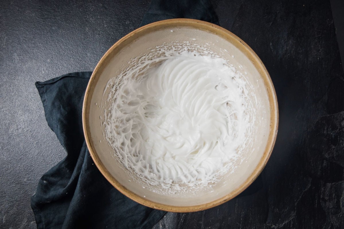 Whipped egg whites in a bowl.