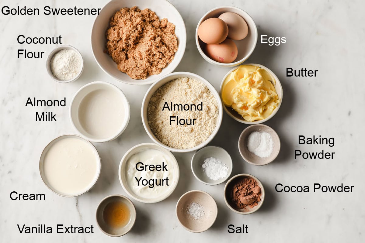 Ingredients to make keto sticky toffee pudding, measured into bowls and labeled.