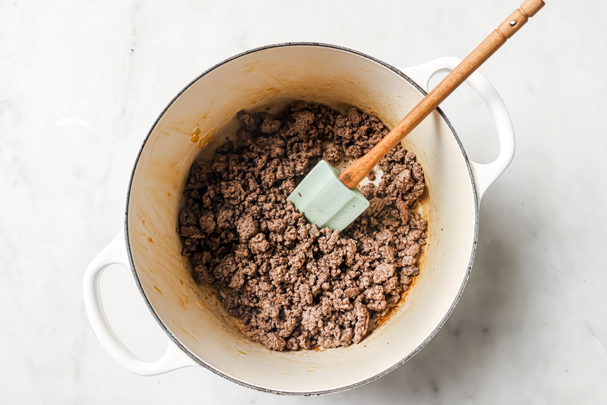 Browning ground beef in a large pot.